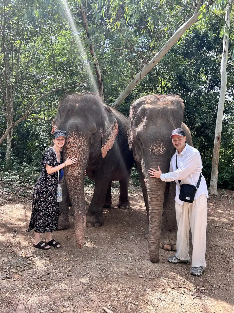 Amir and Kate with two elephants