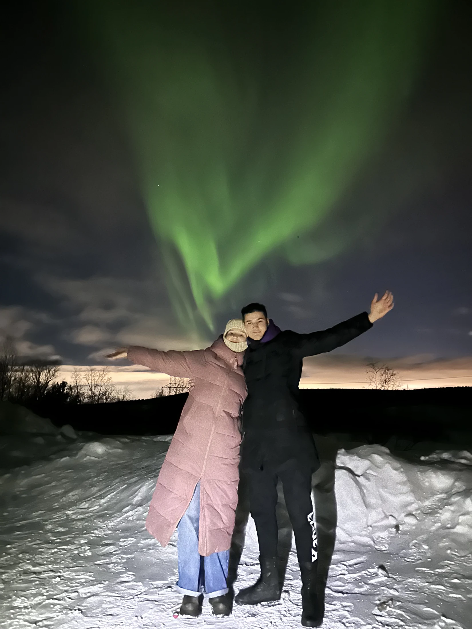 Amir and Kate under the northern lights